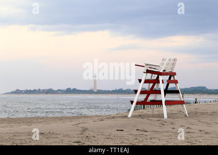 Beach at sunset in Cape May, New Jersey, USA with the Cape May Point  Lighthouse in the background Stock Photo - Alamy