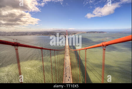 Amazing aerial view of the Golden Gate Bridge in San Francisco, California on a beautiful sunny day with traffic below. Stock Photo