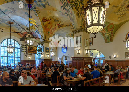 People drinking and eating inside the Hofbräuhaus in Munich, Germany Stock Photo