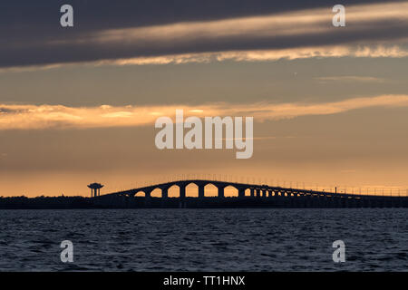 Sunset by the swedish Oland bridge connecting the island Oland with mainland Sweden Stock Photo