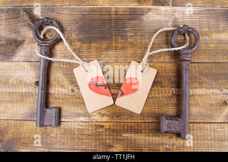 Keys to love, Conceptual photo. On color wooden background Stock Photo