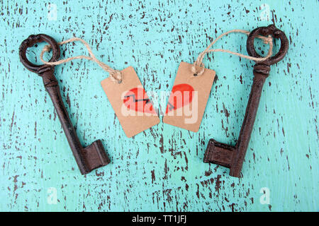Keys to love, Conceptual photo. On color wooden background Stock Photo