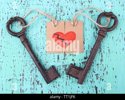 Keys to love, Conceptual photo. On color wooden background Stock Photo