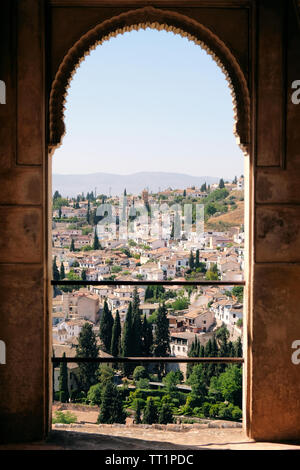 View of El Albaicin neighborhood and Granada from an open Moorish style doorway in the Alhambra in Granada, Spain. Stock Photo