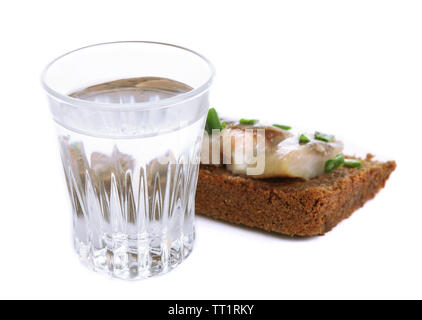 Composition with glass of vodka, and  sandwiches wit salted fish, isolated on white Stock Photo