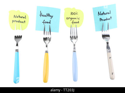 Note papers with messages  attached to forks, isolated on white Stock Photo