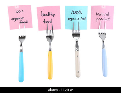 Note papers with messages  attached to forks, isolated on white Stock Photo