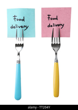 Note papers with messages  attached to forks, isolated on white Stock Photo