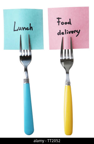 Note papers with messages  attached to forks, isolated on white Stock Photo