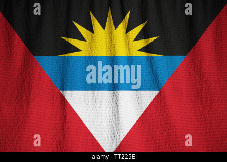 Ruffled Flag of Antigua and Barbuda Blowing in Wind Stock Photo