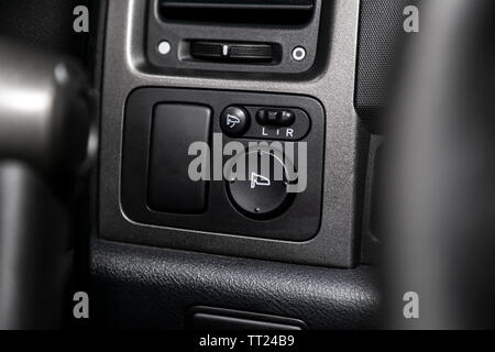 Close-up of the  buttons: side mirror adjustment buttons. modern car interior, soft focus Stock Photo