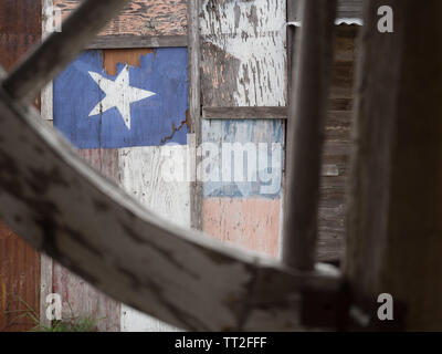 Faded Texas flag painted on the side of an old building in the ghost town of Loraine, Texas Stock Photo