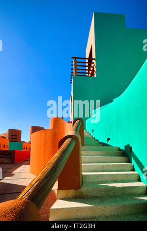 Low Angle View of Bold Colored Mexican Style Architecture, Cabo San Lucas, Baja California Sur, Mexico Stock Photo