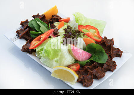 cig kofte called dish made of raw ground meat, pounded wheat, and red pepper turkish cuisine Stock Photo