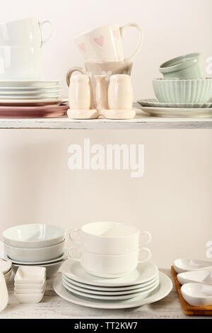 Different tableware on shelf, close up Stock Photo - Alamy