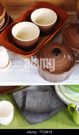 Different tableware on shelf, close up Stock Photo - Alamy