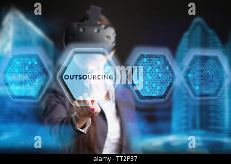 The concept of business, technology, the Internet and the network. A young entrepreneur working on a virtual screen of the future and sees the inscrip Stock Photo