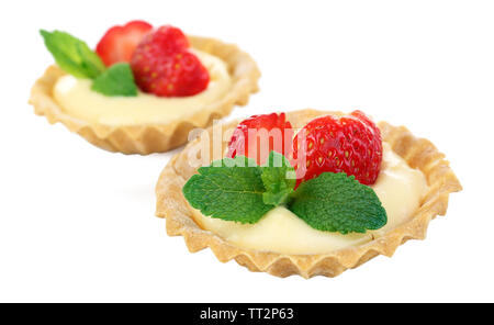 Tasty tartlets with strawberries isolated on white Stock Photo