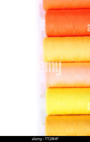 Multicolor sewing threads background isolated on white Stock Photo - Alamy