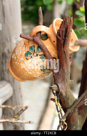 Old retro amphora in garden Stock Photo