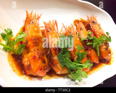 This menu is Deep Fried Shrimp with Tamarind Sauce. It is one of delicious Thai food. In this dish, there are five shrimps that are topped Stock Photo