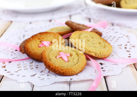 Sugar cookies in shape of buttons on table Stock Photo