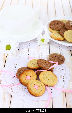 Sugar cookies in shape of buttons on table Stock Photo