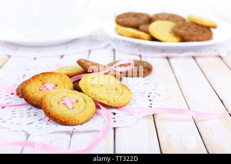 Sugar cookies in shape of buttons on table Stock Photo