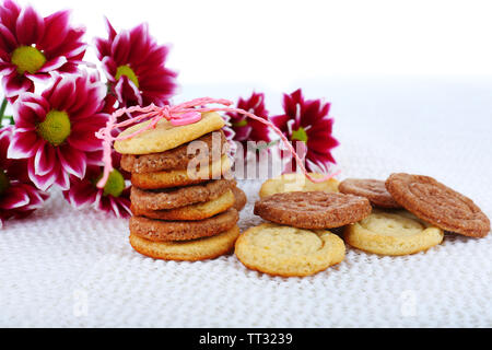 Sugar cookies in shape of buttons on table Stock Photo