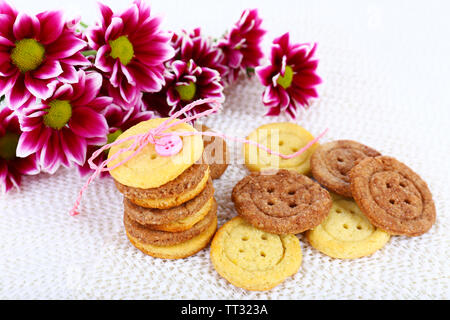 Sugar cookies in shape of buttons on table Stock Photo