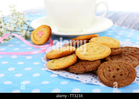 Sugar cookies in shape of buttons on table Stock Photo