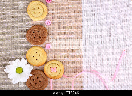 Sugar cookies in shape of buttons on table Stock Photo