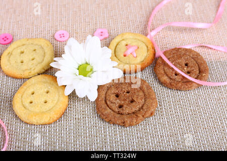 Sugar cookies in shape of buttons on table Stock Photo