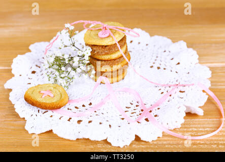 Sugar cookies in shape of buttons on table Stock Photo