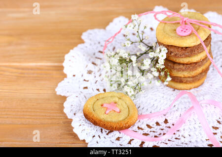 Sugar cookies in shape of buttons on table Stock Photo