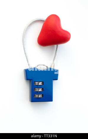 Red heart on a blue combination lock on white background Stock Photo