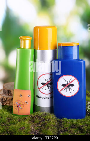 Bottles of insect repellent on green grass Stock Photo - Alamy
