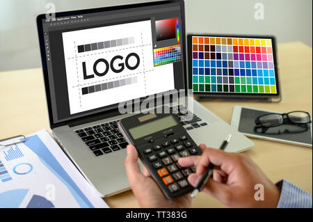Creative Designer Graphic at work. , Illustrator Graphic designer working digital tablet and computer Color swatch samples Stock Photo