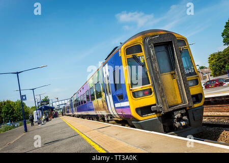 A Northern Rail class 158 passenger train at Brough railway station, Yorkshire, England.