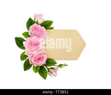 Pink rose flowers with green leaves in a floral arrangement on craft paper label Stock Photo