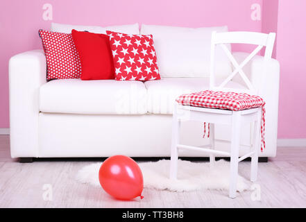 White sofa close-up in room on pink background Stock Photo
