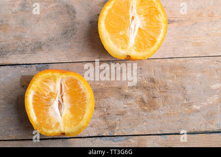 two oranges on wooden table, rustic background,top view Stock Photo
