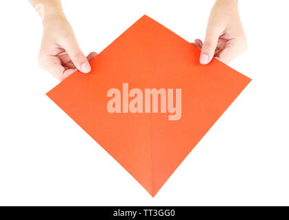 Hands making origami rabbit, close up, isolated on white Stock Photo