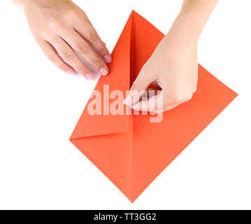 Hands making origami rabbit, close up, isolated on white Stock Photo