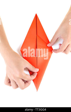 Hands making origami rabbit, close up, isolated on white Stock Photo