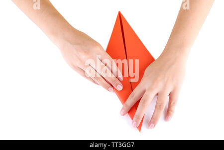 Hands making origami rabbit, close up, isolated on white Stock Photo
