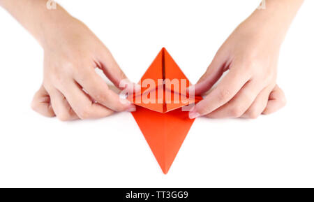 Hands making origami rabbit, close up, isolated on white Stock Photo