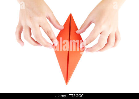 Hands making origami rabbit, close up, isolated on white Stock Photo