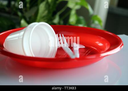 Group of plates with disposable plastic glasses and forks Stock Photo