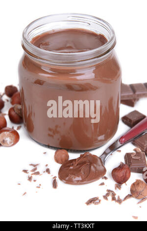 Sweet chocolate cream in jar isolated on white Stock Photo